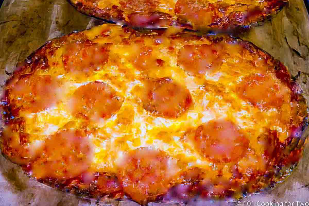 tortilla pizza on pizza stone.