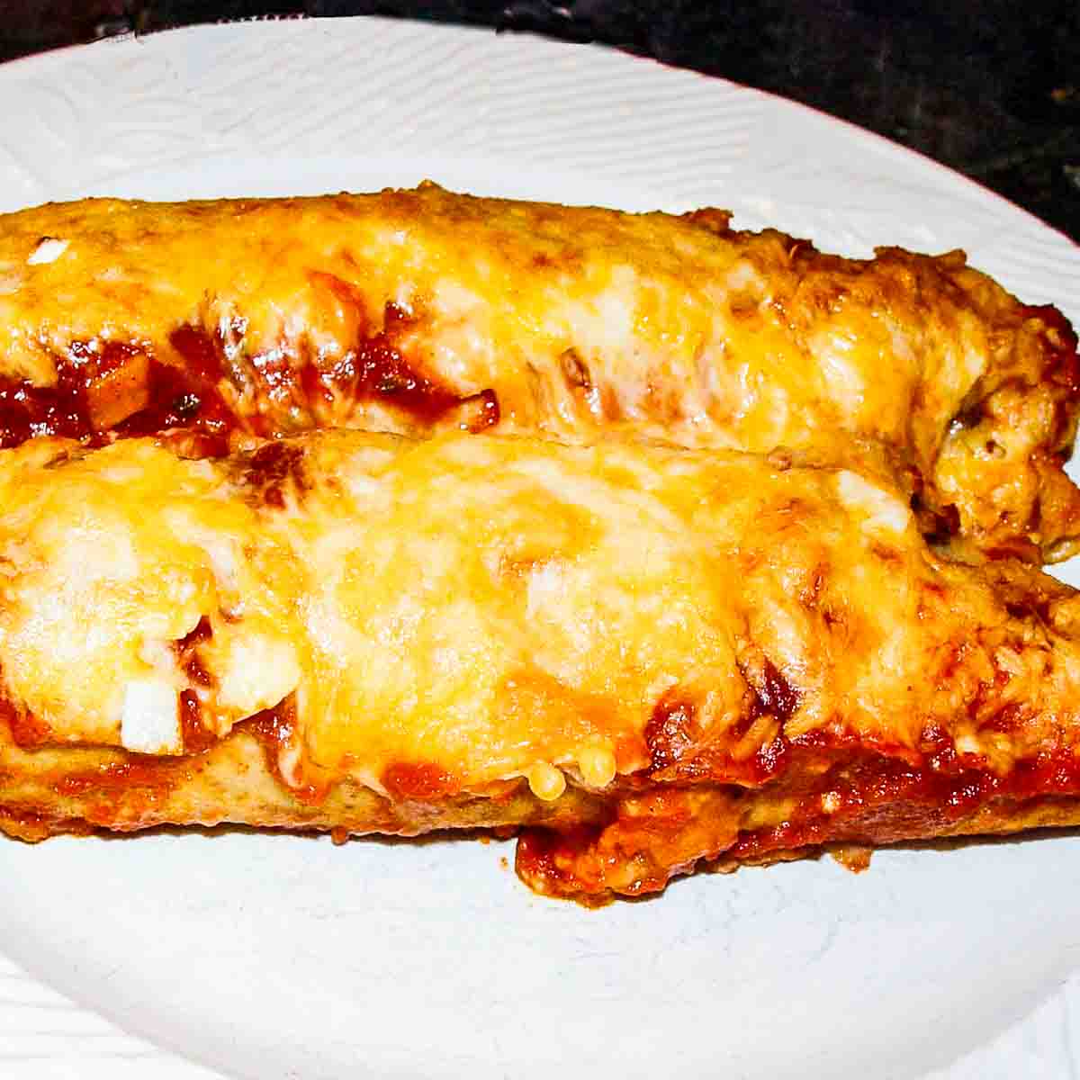 chicken enchiladas on a white plate