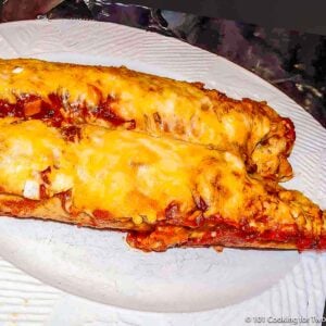 chicken enchiladas on white plate.