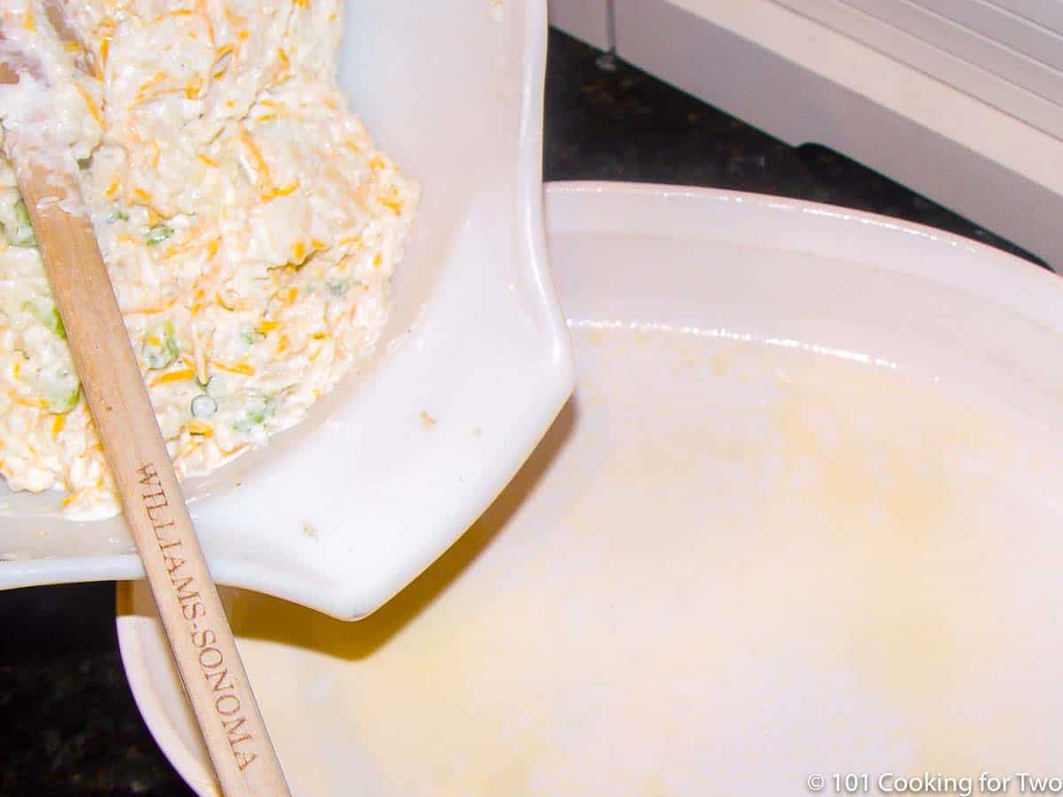 moving casserole filling to baking dish.