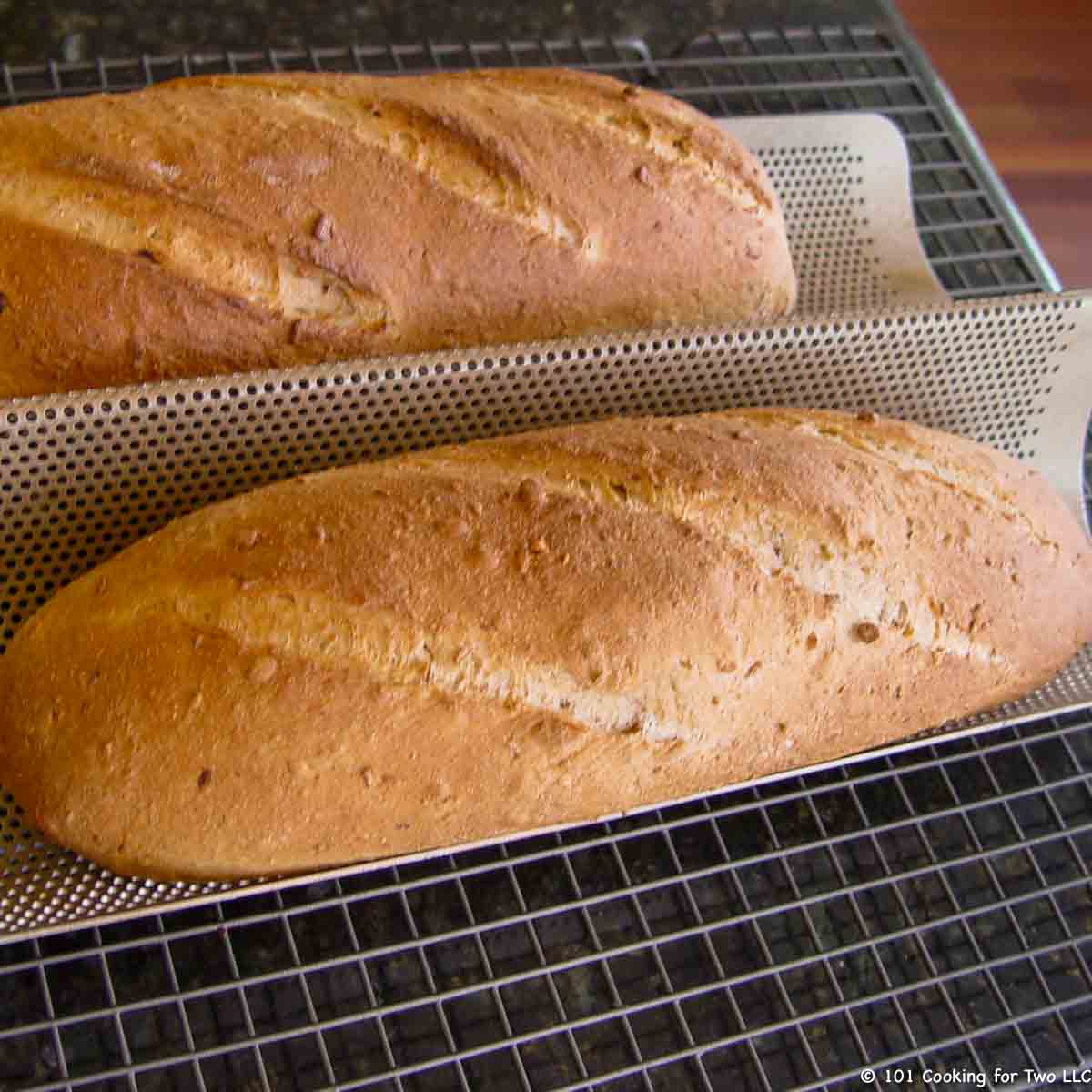 two loaves of multigrain French bread.