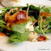 close up image of Fresh Spinach Salad on a white plate