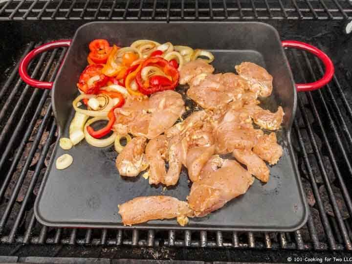 adding raw chicken to griddle