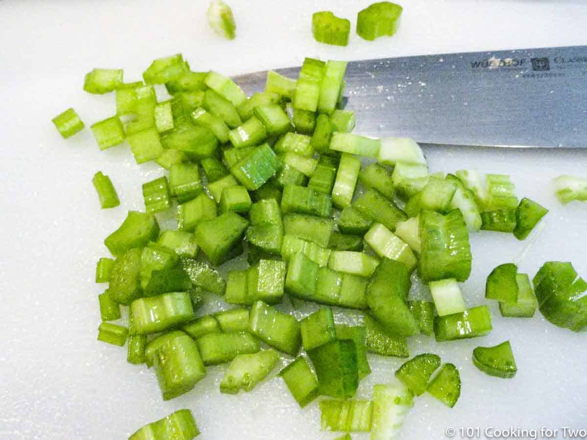 chopped celery on white board