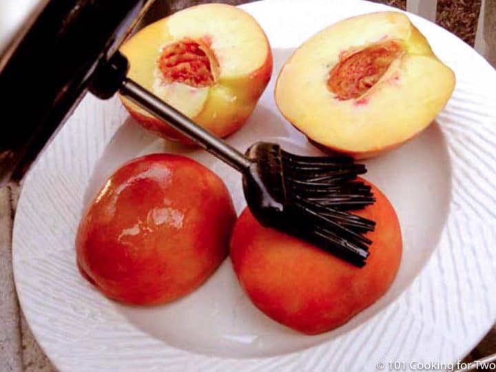 brushing peach halves with oil