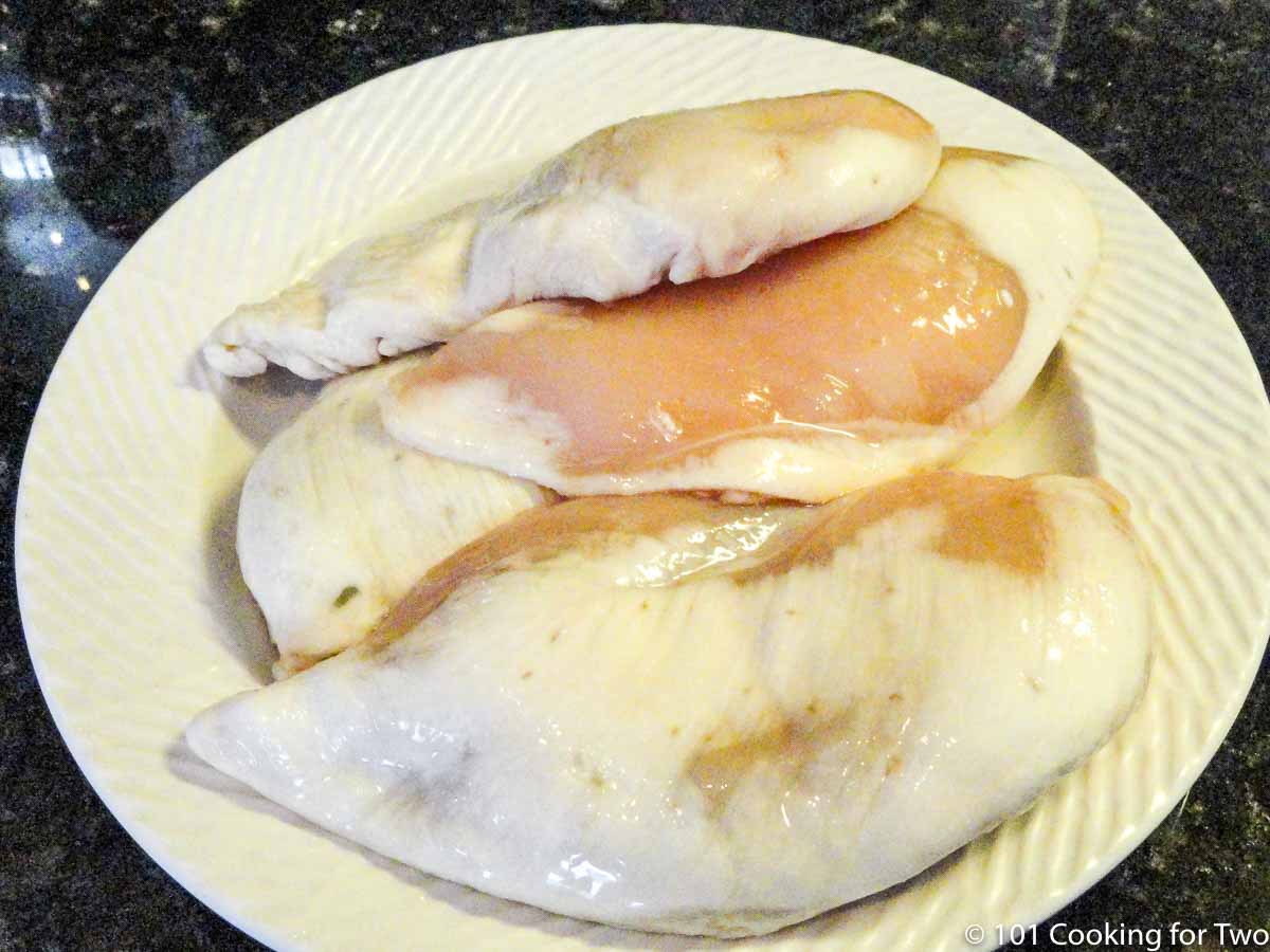 frezer burnt chicken on white plate