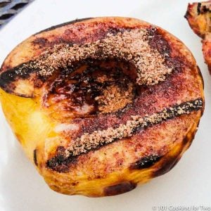 grilled peach on white plate