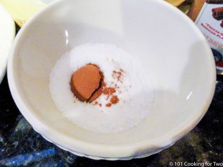 mix sugar and cinnamon in bowl