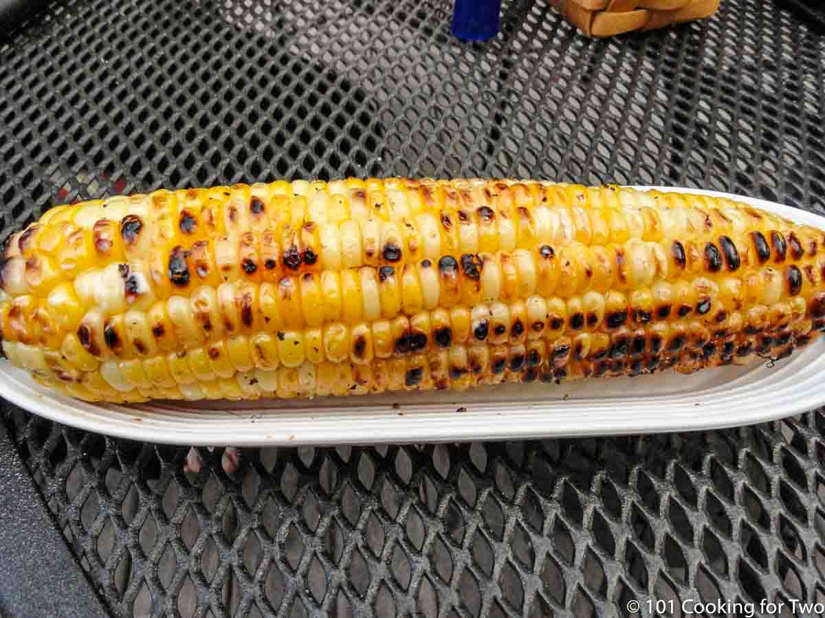 grilled corn on white tray