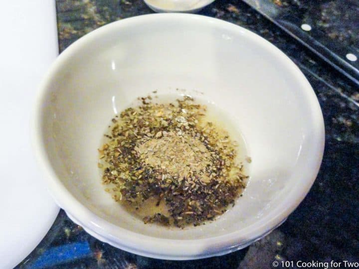 Mixing seasoning in white bowl