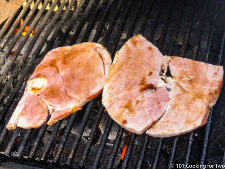 glazed ham on the grill grates