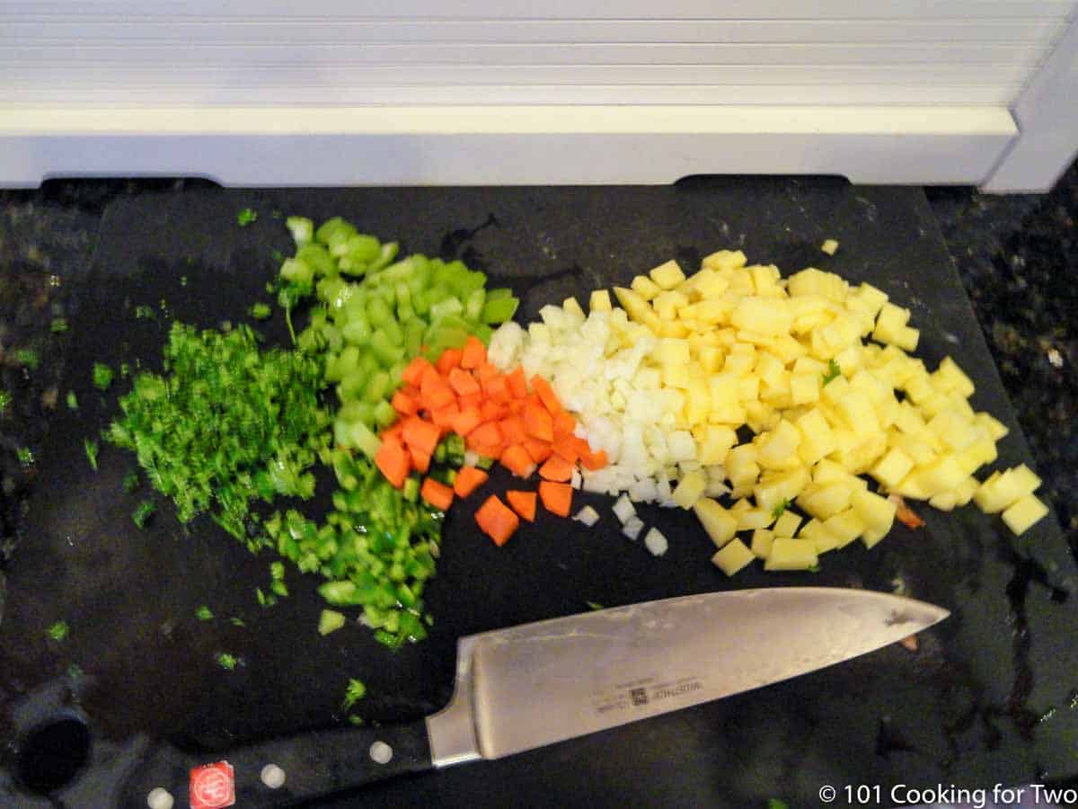 chopped veggies on black board.