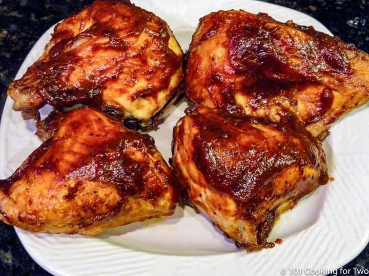 BBQ chicken breasts on white plate