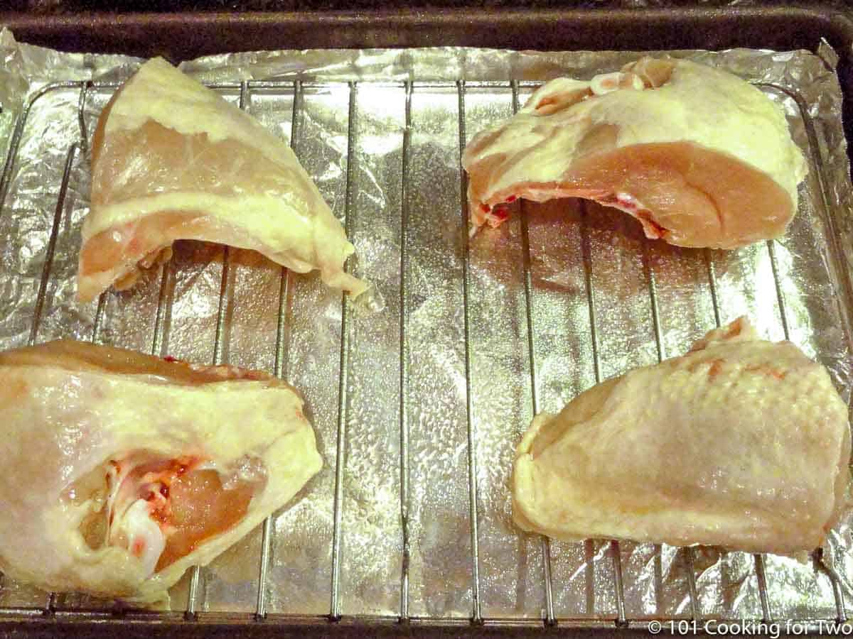 chicken breast halves on rack.