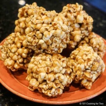 pile of Popcorn Balls on an orange plate