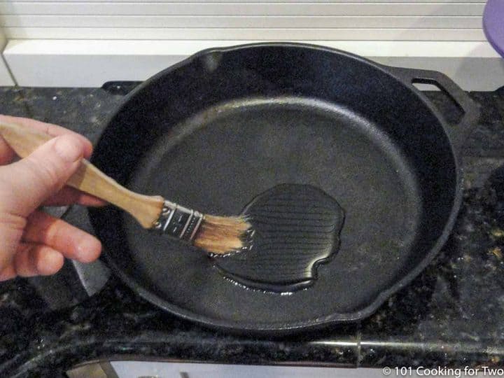 brushing oil coating in a cast iron pan