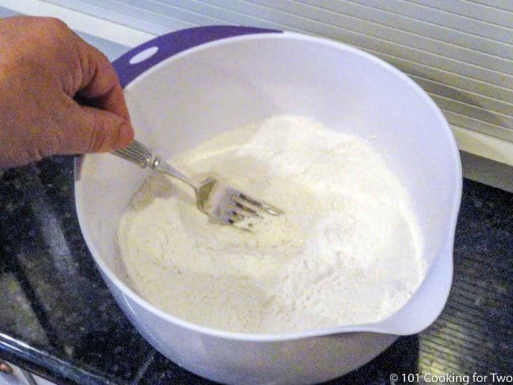 cutting butter into flour mixture