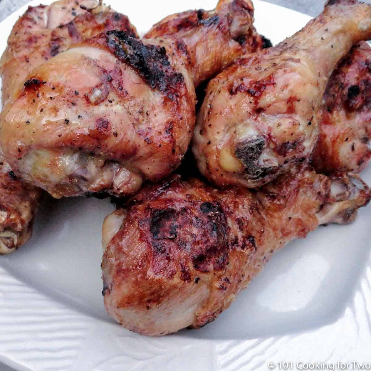 grilled chicken legs on white plate