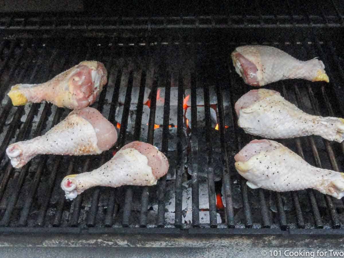 raw chicken on gas grill