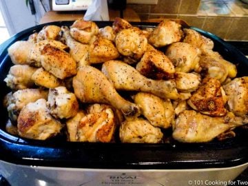roaster full of cooked chicken