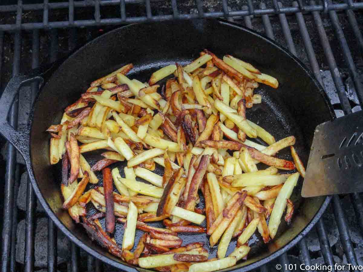 using a metal spatula to flip fries