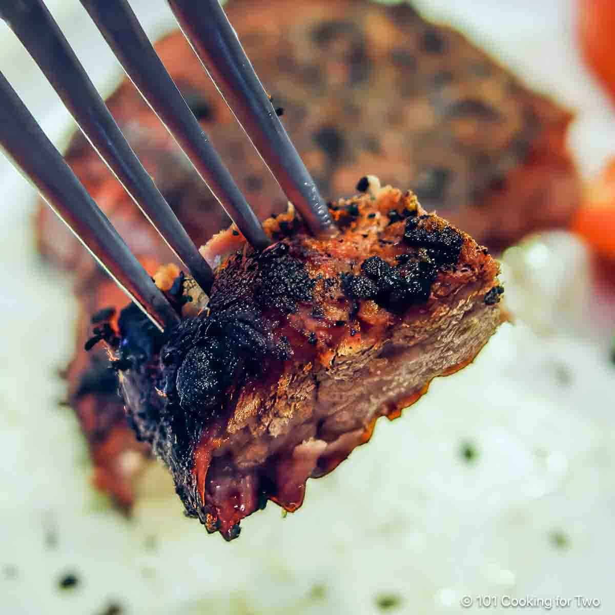 coffee rubbed steak on a fork