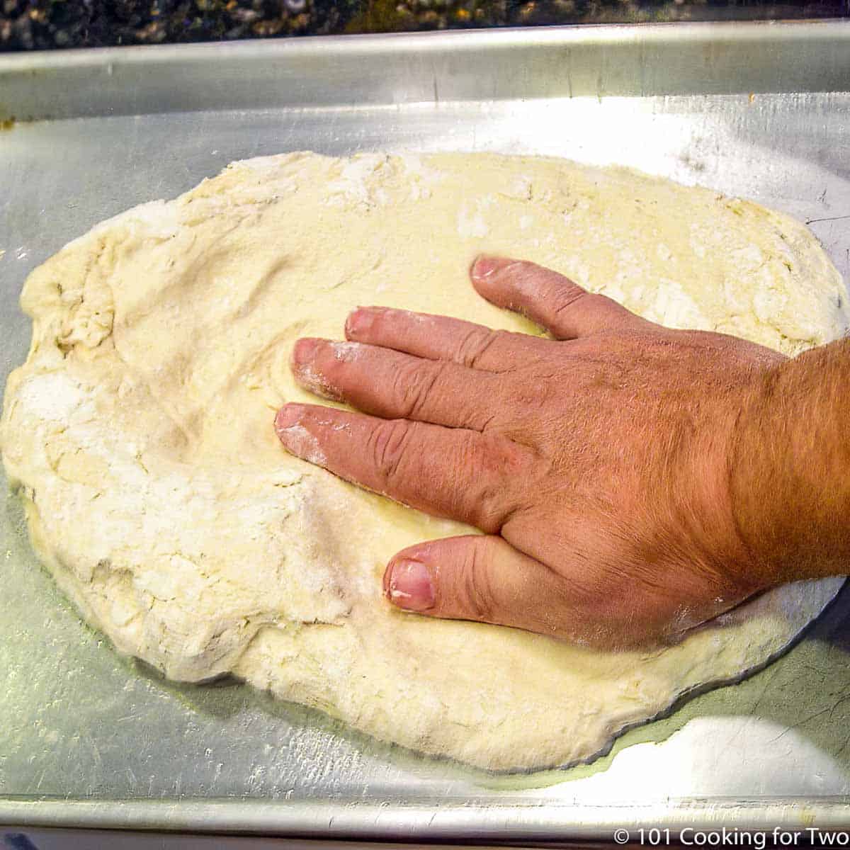 making out pizza dough.