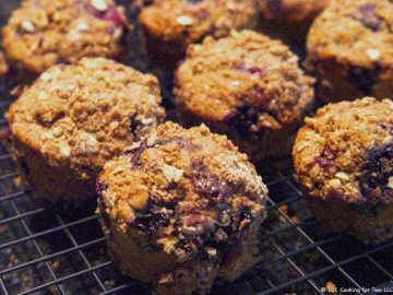 whole wheat blueberry muffin cooling on rack