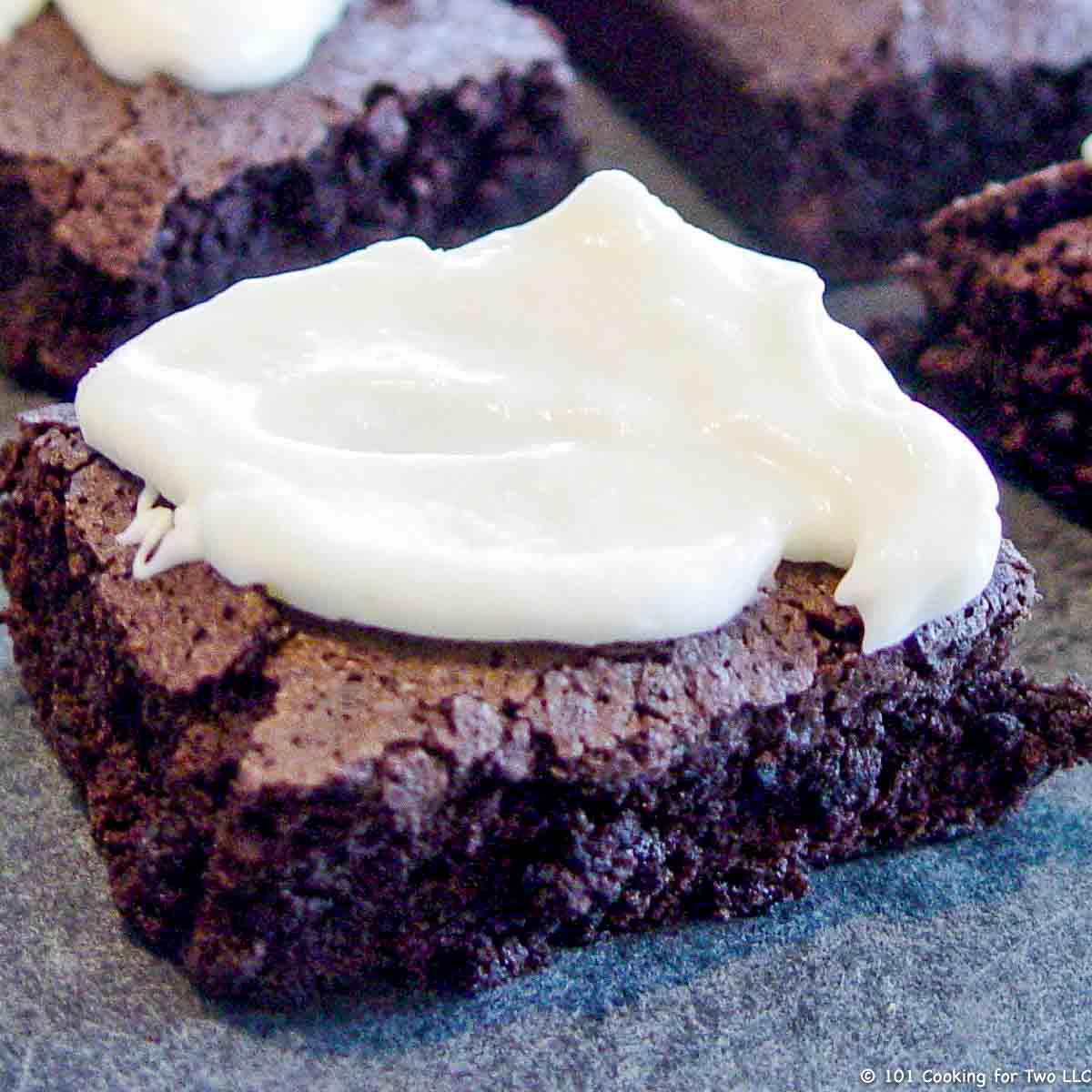 brownie on tray with frosting
