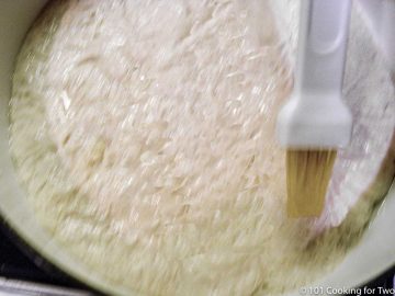 brushing dough with water