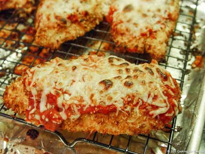 cooked chicken parmesan on tray