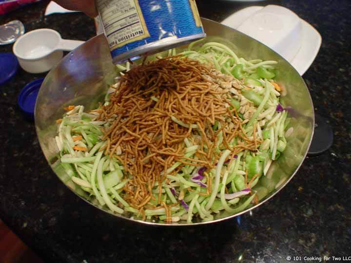 adding noodles to veggies