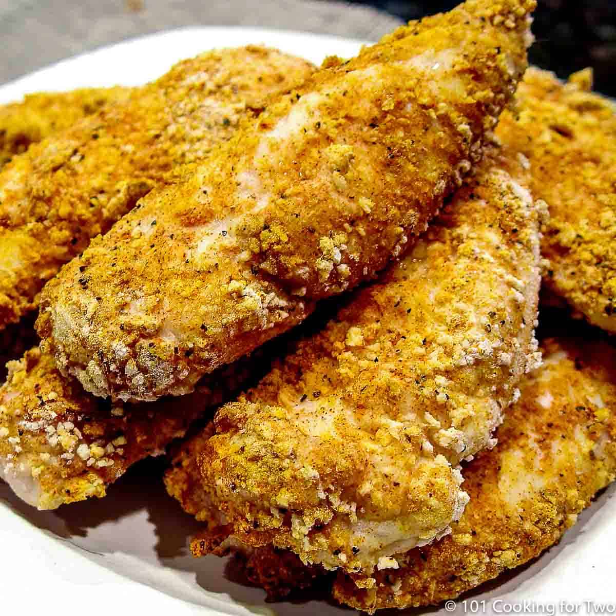 chicken tenders on white plate