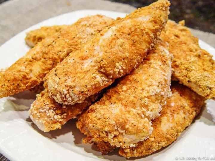 pile of chicken tenders on white plate