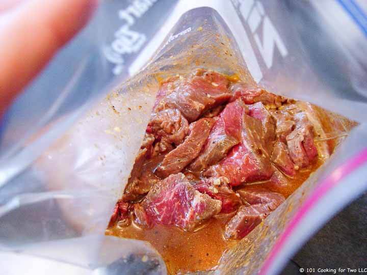 cubes of beef in bag with marinade,