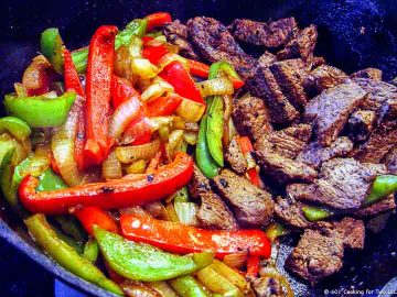 veggies and meat browned in skillet