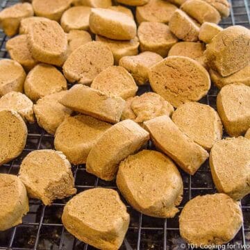 Pile of homemade dog treats on a wire rack