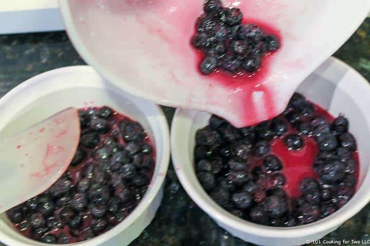 adding berries to bowl.