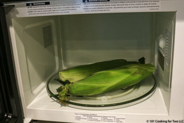 two ears of corn in microwave