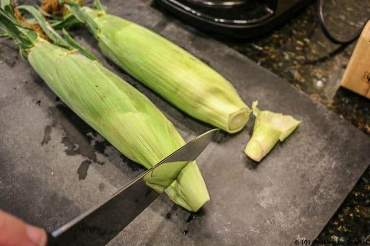 trim stalk off corn.