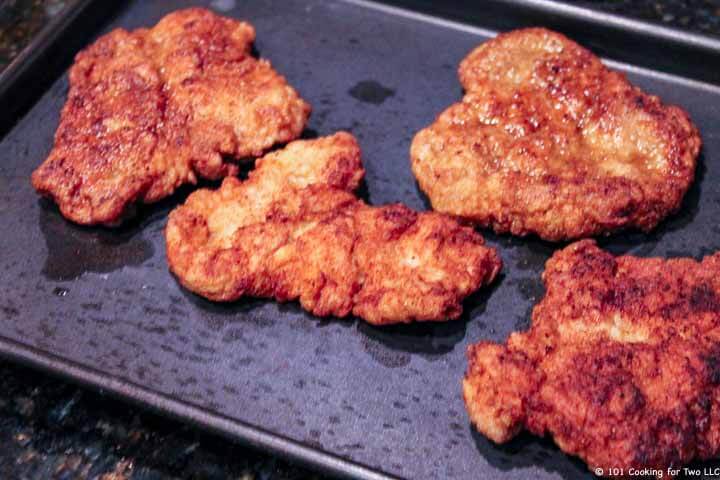 four tenderloins staying warm on tray.