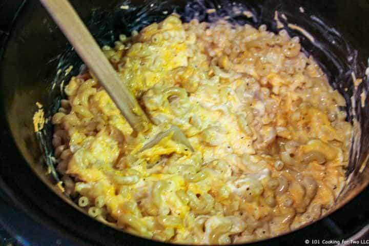 mixing in the macaroni to crock pot