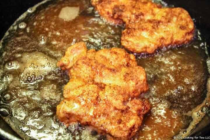 two tenderloins frying in oil.