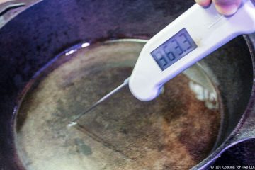 checking temperature of oil in pan