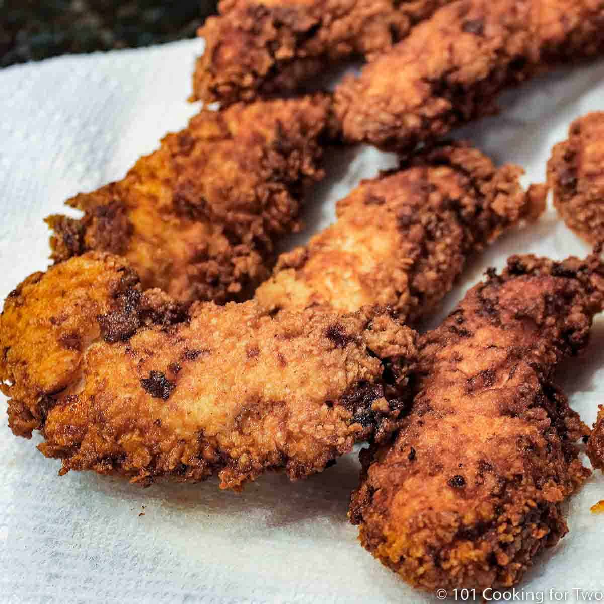 close up of cripsy fried chicken tender.