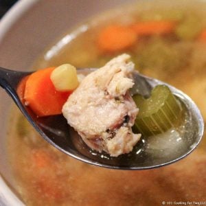 chicken vegetable soup in spoon