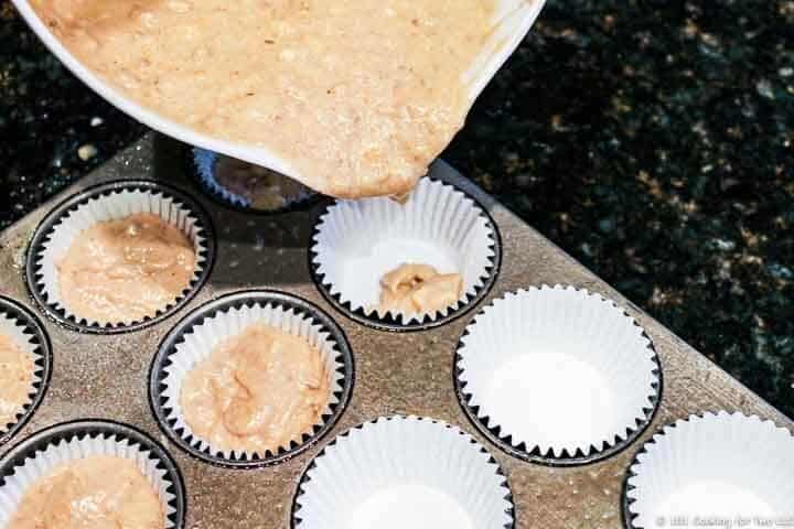 filling cupcake paper with batter