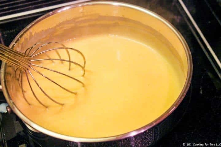 added cheese and whisk sauce