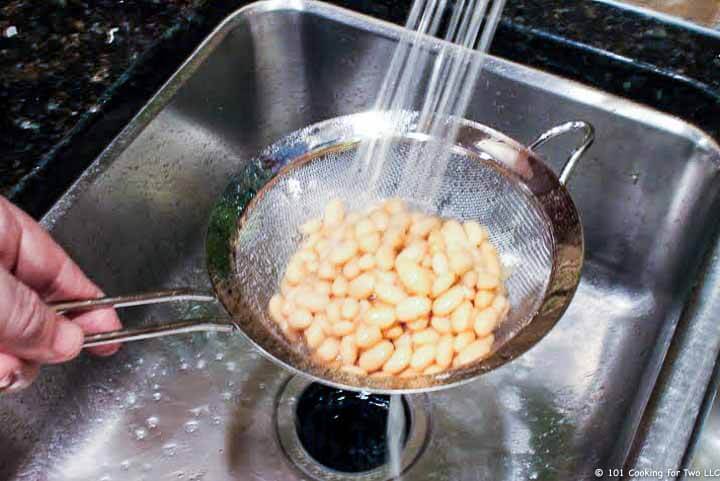 beans rinsing under water