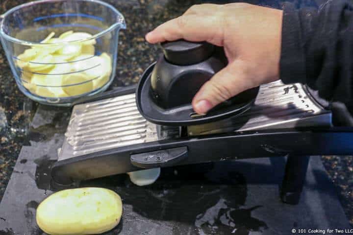 slicing potato with a madoline.